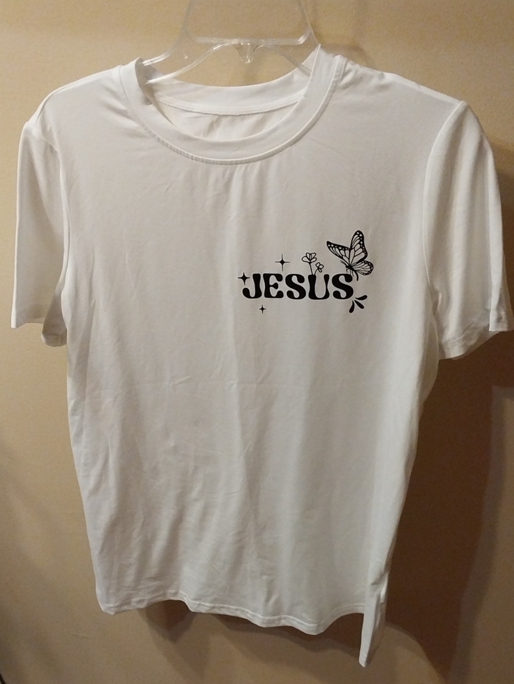 White T‑Shirt with 'JESUS' Text & Butterfly Graphic